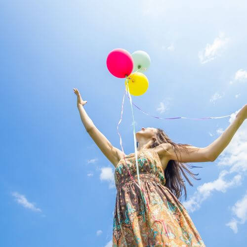 Helps us let go of anger and resentment: An image of a person releasing a balloon