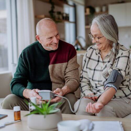 Lowers blood pressure: An image of a blood pressure checking persons are calm and smiling