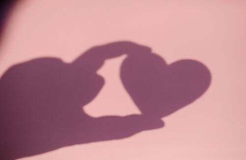 A shadow of a picture of a heart-shaped object