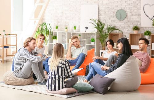 A group of people supporting and uplifting one another, emphasizing the importance of a positive and empowering social network