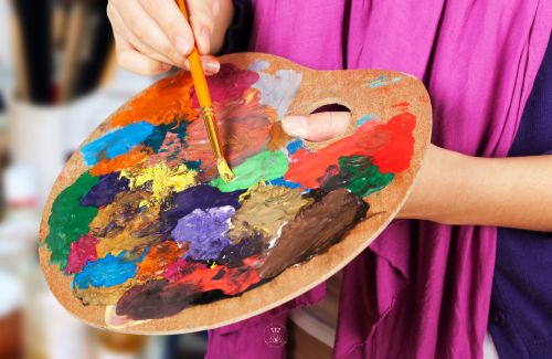 An artist's palette with vibrant colors, representing the diversity of imagination.