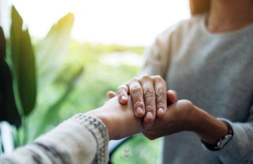 Image of two hands, representing the concept of giving and receiving.