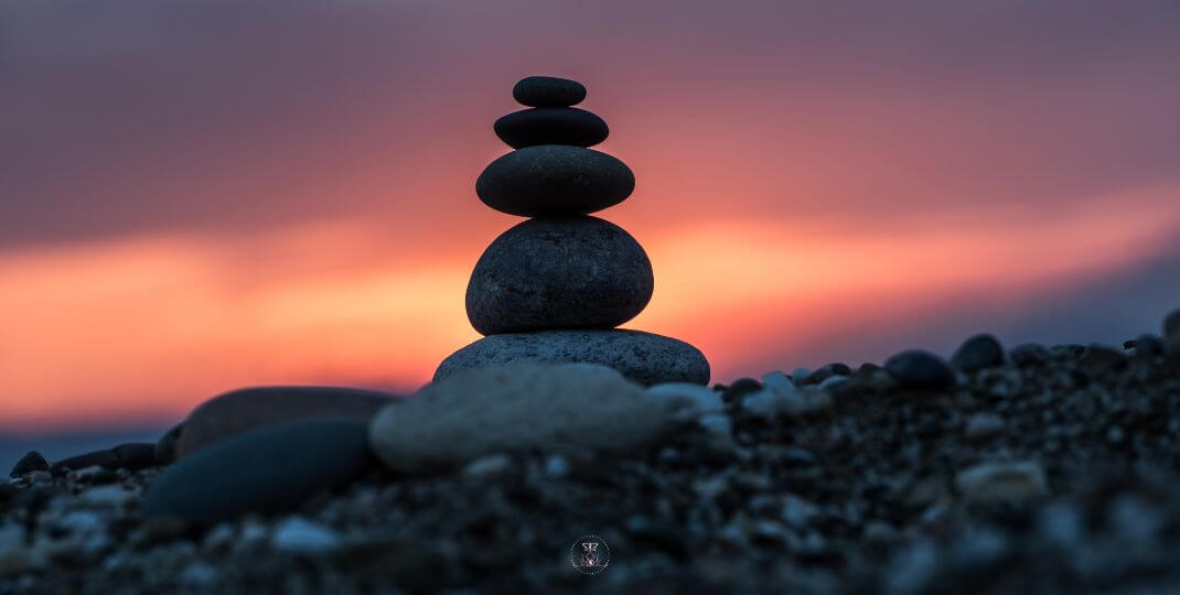 Overcoming Negative Thoughts - Balancing Stones - Stack of balanced stones in nature.