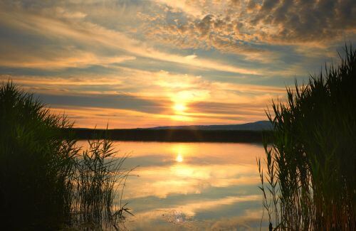 Finding Happiness Within - Sunlight Breaking Through Clouds over Calm Lake