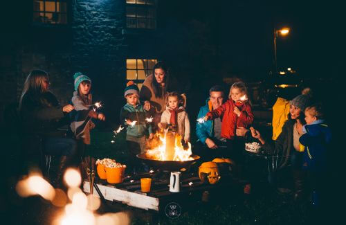 The Gift of Presence - Image of a Candlelit Gathering