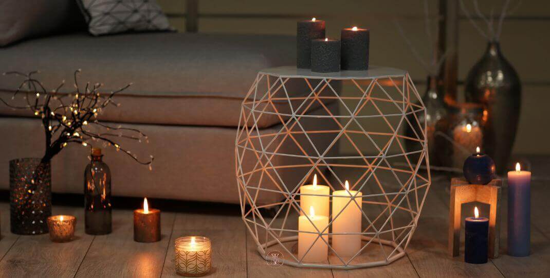 The Energy of Words - A quiet room with candles glowing in the center, embodying the calming strength of silence.