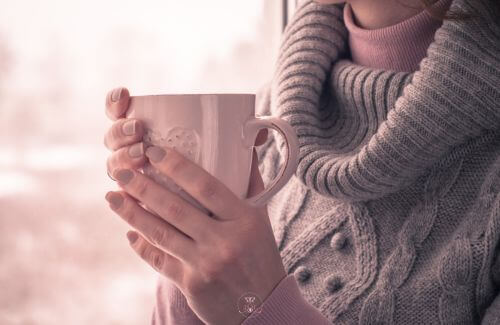 Power of Pausing for Inner Peace - A close-up of hands holding a warm cup of tea